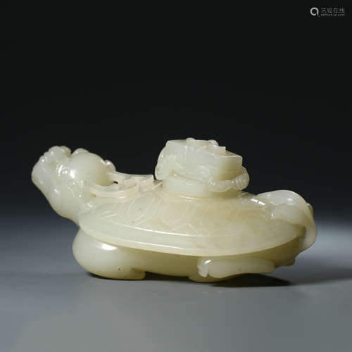 A Carved White Jade Dragon and Turtle Ornament