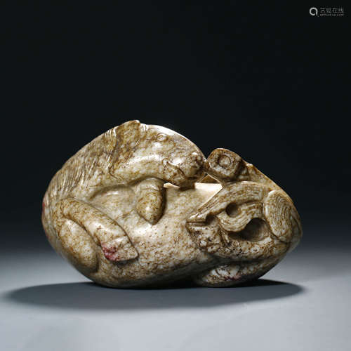 A Carved Burnt Jade Recumbent Horse Ornament