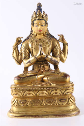 A Gilt Copper Four-Arm Avalokitesvara Statue.