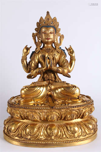 A Four-Arm Guanyin Bodhisattva Statue.