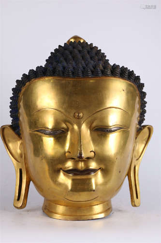 A Gilt Copper Sakyamuni's Head Sculpture.