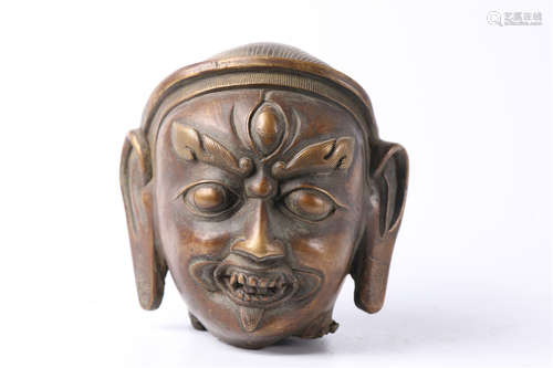 A Copper Buddha's Head Sculpture.