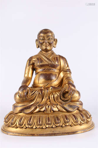 A Gilt Copper Guru Buddha Statue.