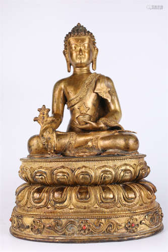 A Gilt Copper Bhaisajyaguru Buddha Statue.