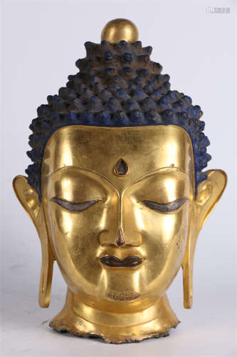 A Gilt Copper Sakyamuni's Head Sculpture.