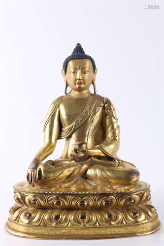 A Gilt Copper Bhaisajyaguru Buddha Statue.