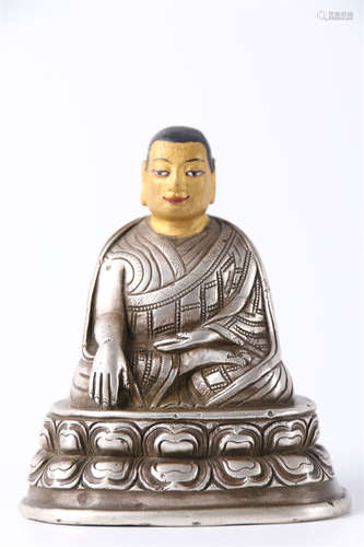 A Silver Guru Buddha Statue.