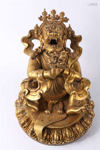 A Gilt Copper Roaring Buddha Statue.