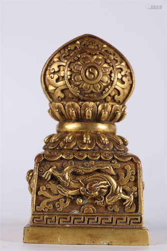 A Gilt Copper Dharma-cakra Seal.