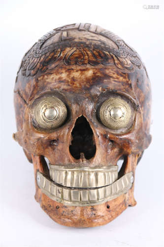 A Bone Skull Head, Inlaid with Silver.