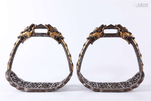 A Pair of Gilt Cast Iron Stirrups.