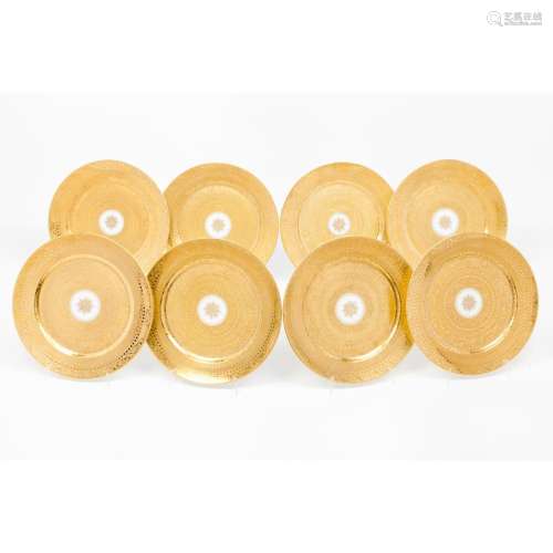 A set of 8 dinner plates