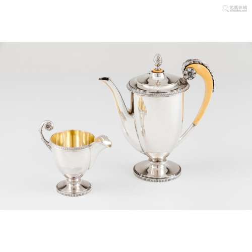 A set of teapot and creamer