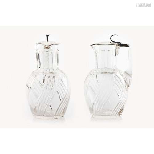 A pair of crystal and silver decanters