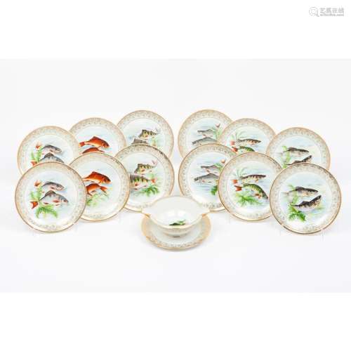 A set of 12 appetizer plates and a sauce boat