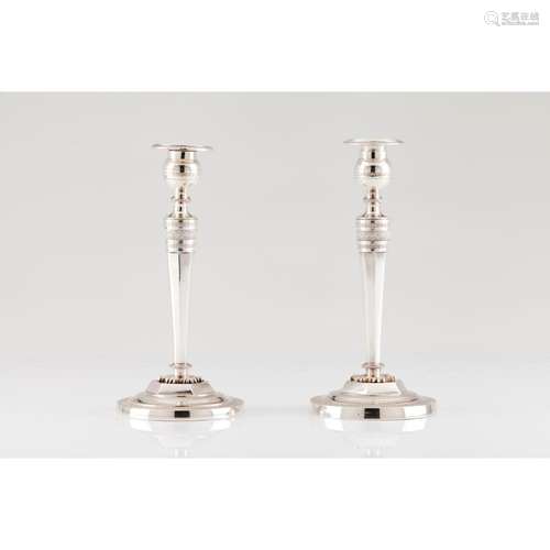 A pair of Consulate candlesticks