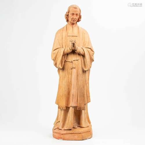 A large statue of a holy figurine of Jean-Marie Vianney (178...