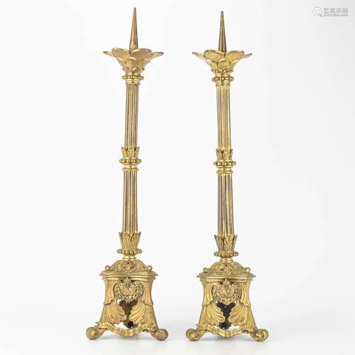 A pair of candlesticks in neogothic style and marked 'L...