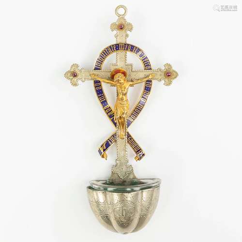 A holy water font with corpus and crucifix, finished with cl...