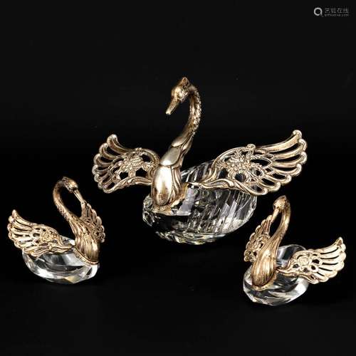 A collection of 3 sugar pots in the shape of a swan, made of...