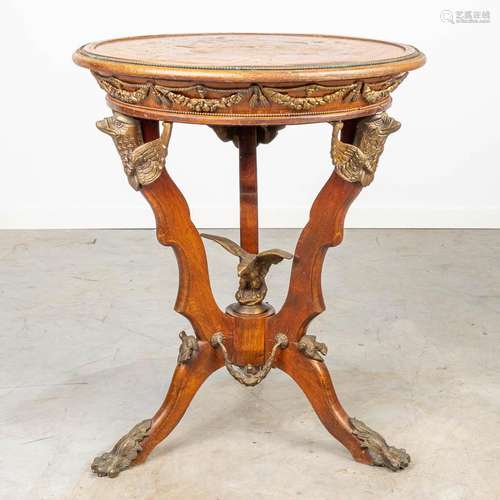 A side table inlaid with marquetry and mounted with bronze.