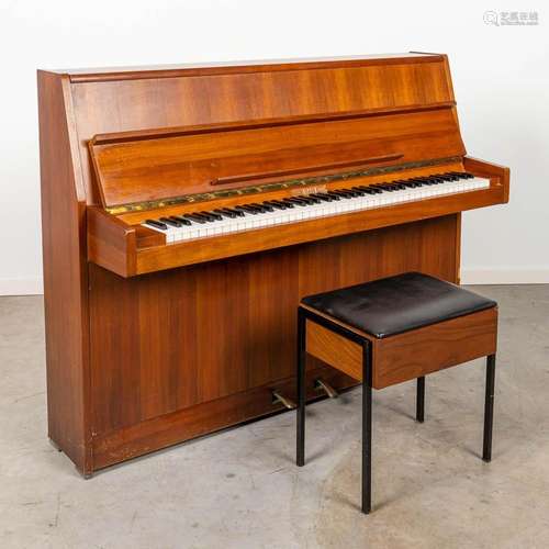 An upright piano with a steel frame and marked Rippen.