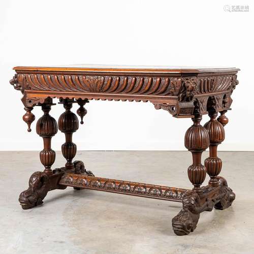 A desk made of oak and decorated with wood sculptured Dolphi...