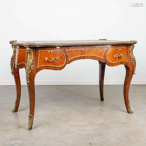 A desk made of wood with veneer and mounted with bronze in L...