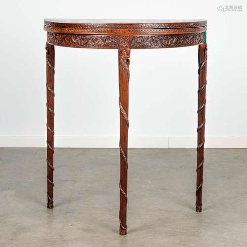 A console or round side table with of sculptured hardwood, p...