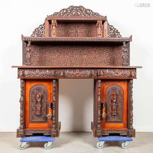 A server cabinet made of hardwood and probably made in Bali,...