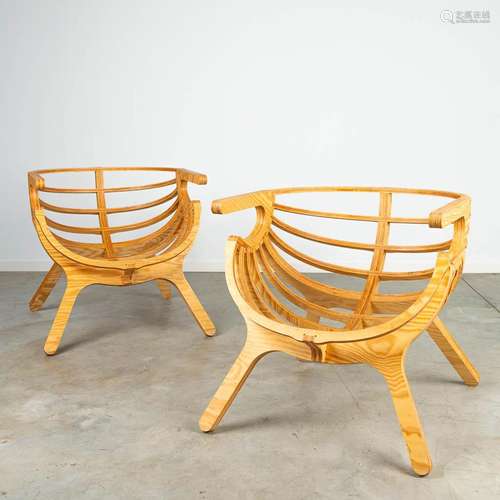 A pair of lounge chairs, made of plywood cut on the CNC mach...