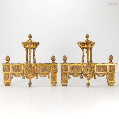 A pair of fireplace andirons made of bronze in Louis XVI sty...