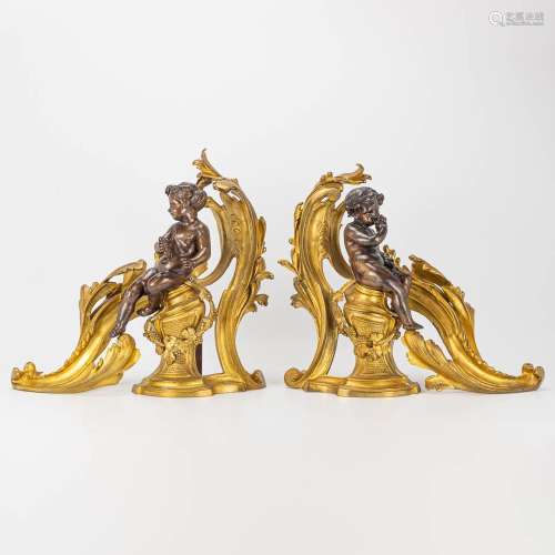 A pair of andirons made of gilt bronze and decorated with Pu...