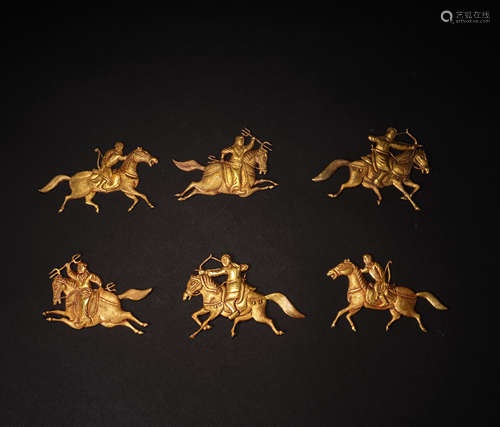 In ancient China, a group of gilt hunting figures