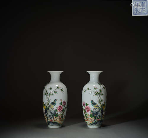 A pair of colorful flowers and birds grain bottles, in the Q...