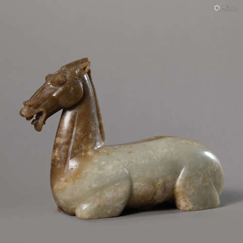 A Carved Russet and White Jade Horse Ornament