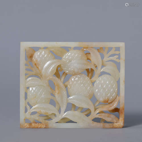 A Carved Russet and White Jade Lychee Rectangular Plaque