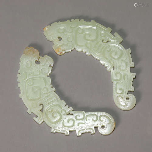 A Pair of Celadon Jade Pendants