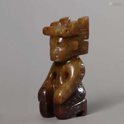 A Carved Russet and Brownish Jade Figure