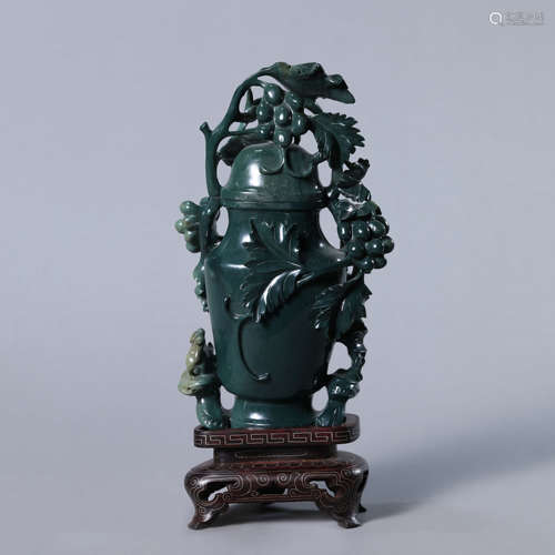 A Carved Jade Squirrel and Grapes Vase and Cover