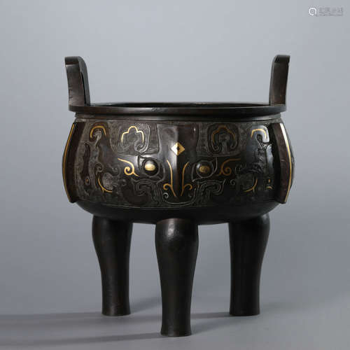 A Bronze Taotie Pattern Gold Decorated Tripod Ding Vessel