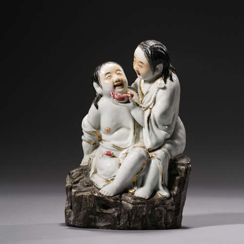 A Carved Porcelain Figurine of Hehe Immortal,