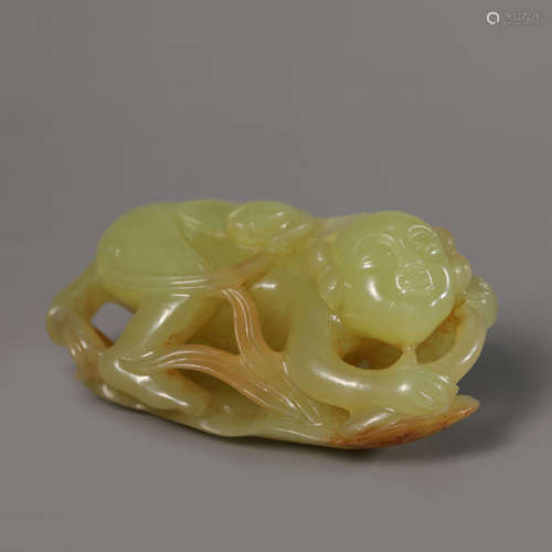 A Carved Yellow Jade Lotus Ornament