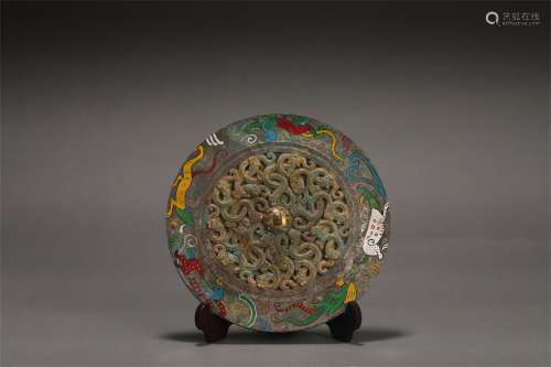 A WARRING STATES PERIOD COLOR PAINTED BRONZE MIRROR