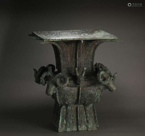 A SHANG DYNASTY FOUR SHEEP SQUARE BRONZE ZUN