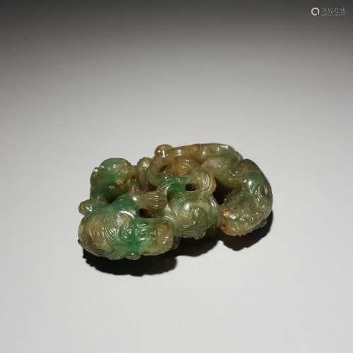 A JADEITE LION PLAYING WITH BALL