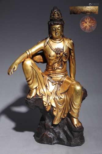 A BRONZE GILDED EASE OF GUANYIN SITTING STATUE