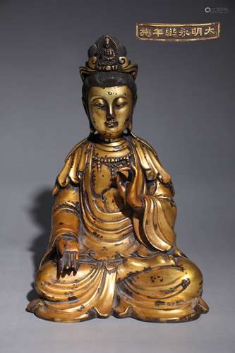 A BRONZE GILDED GUANYIN SITTING STATUE