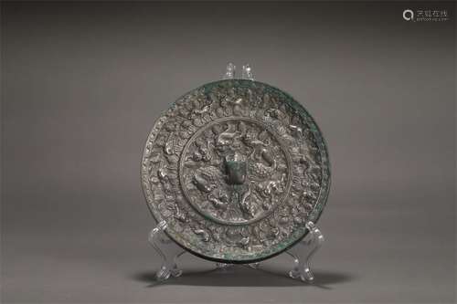 A WARRING STATES PERIOD SEA BEAST PATTERN BRONZE MIRROR