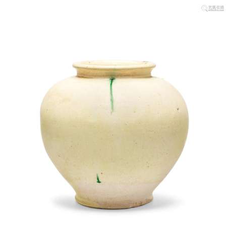 A green-splashed cream-glazed pale pottery jar